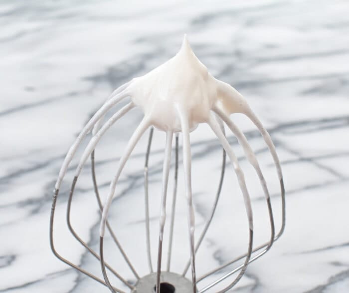 whipped egg whites on a beater.