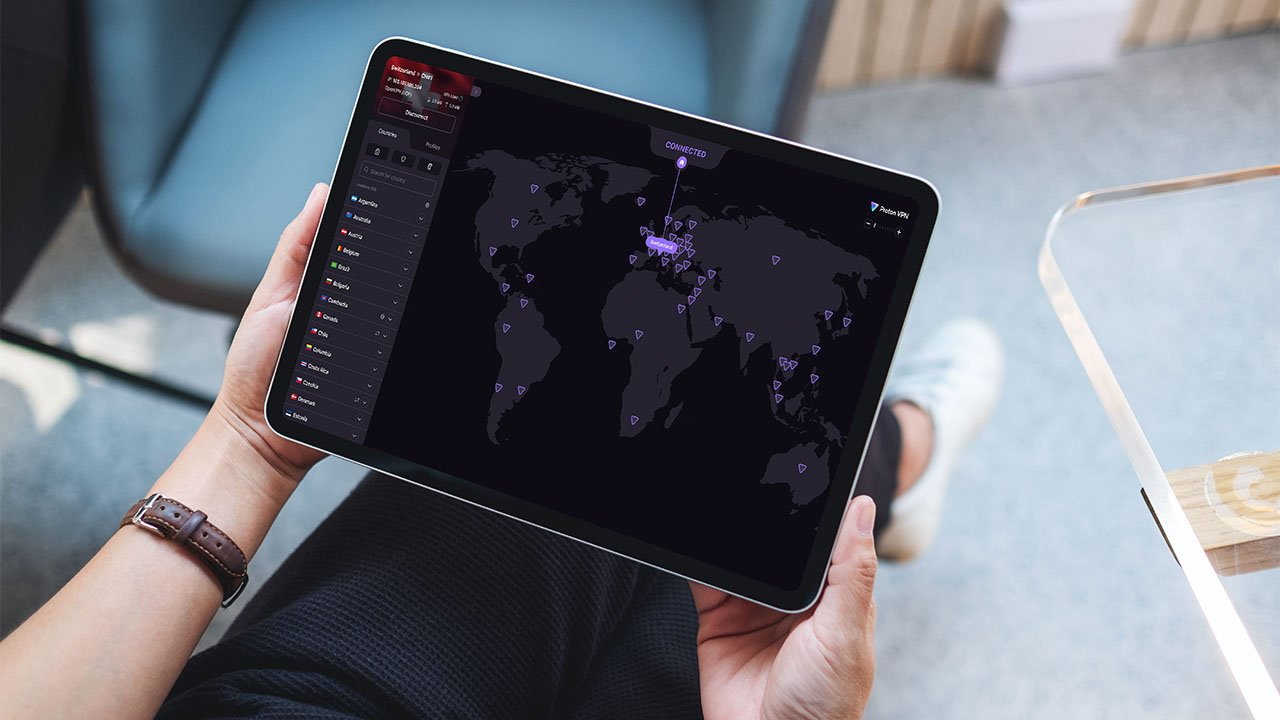 Person holding a tablet displaying a world map with highlighted locations and a menu of country names on the side to show Proton VPN server locations.